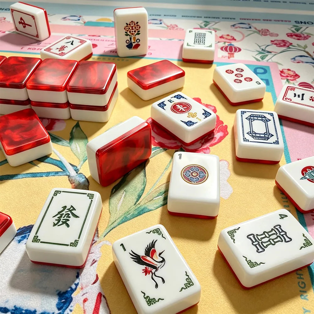Detailed view of red and white gemstone acrylic Mahjong tile designs