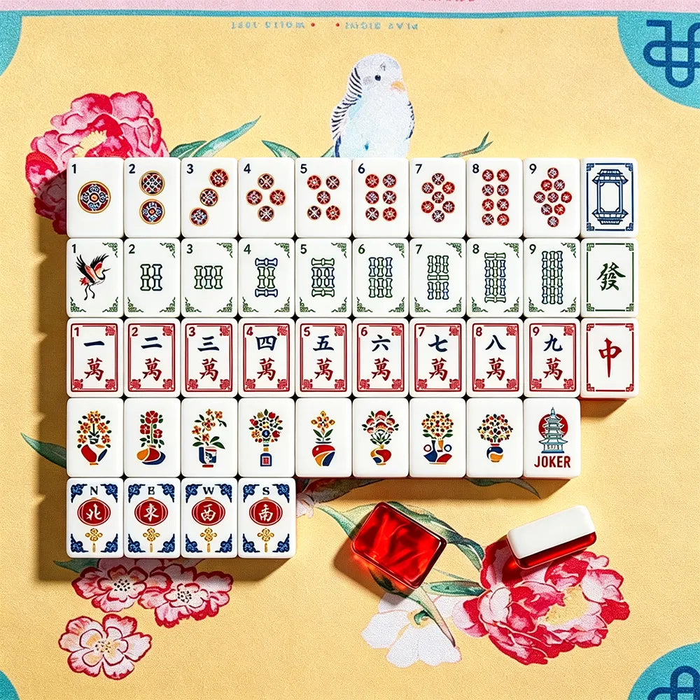 Complete red gemstone crane acrylic Mahjong tile set displayed on a pink background
