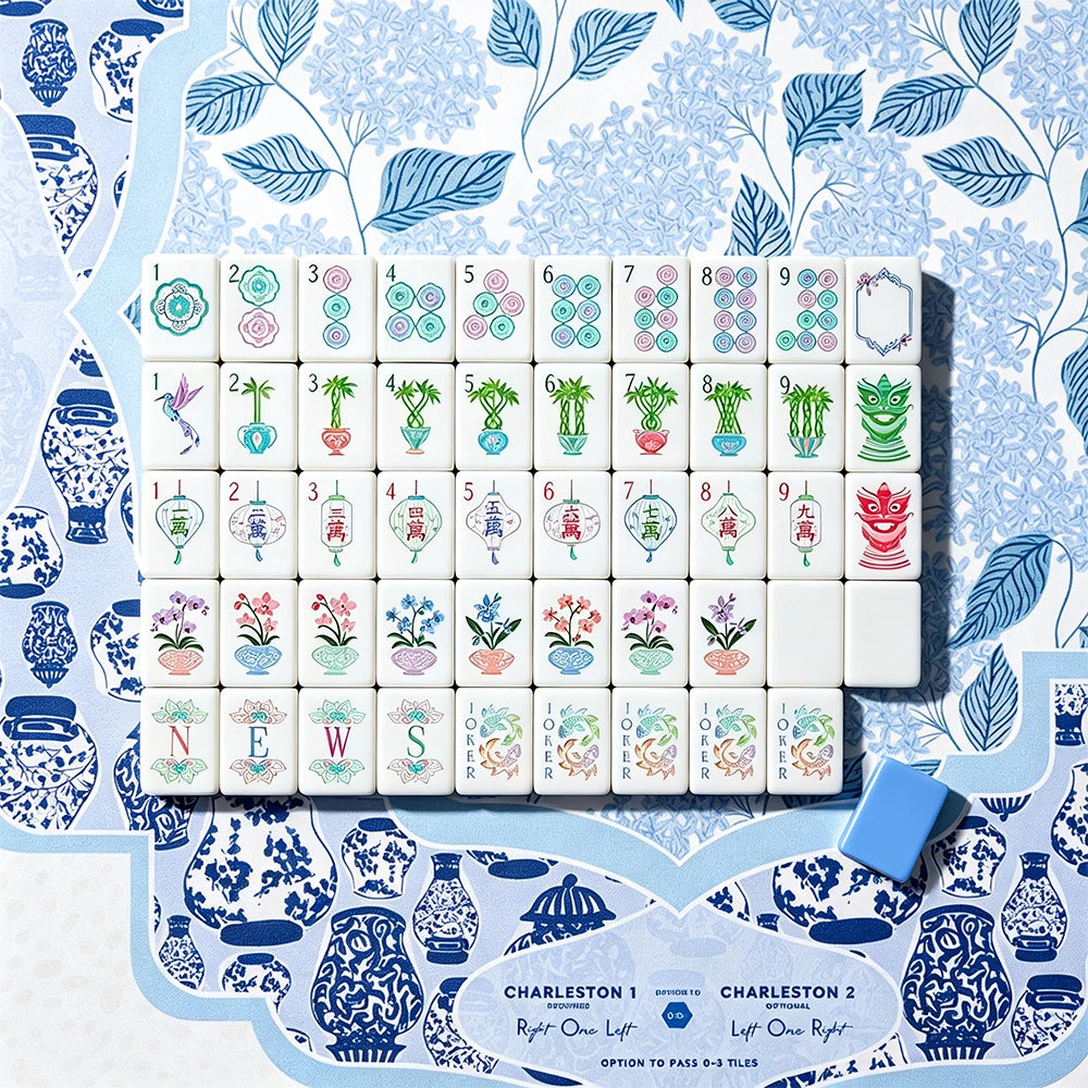 Full set of hand-illustrated Mahjong tiles on a blue chinoiserie mat with a periwinkle acrylic tile