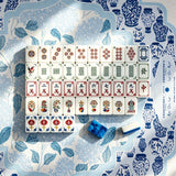 Full layout of hand-illustrated Mahjong tiles on a blue chinoiserie mat with a blue marbled acrylic tile
