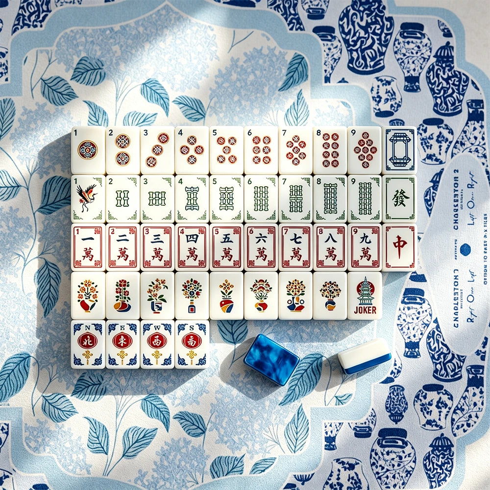 Full layout of hand-illustrated Mahjong tiles on a blue chinoiserie mat with a blue marbled acrylic tile