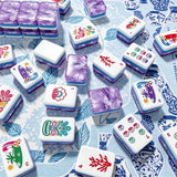 Mahjong Tiles and Game Pieces on Patterned Background