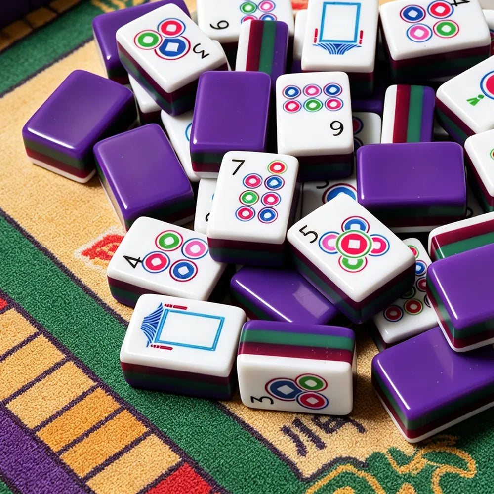 Purple acrylic Mahjong tiles with colourful modern designs on a game table
