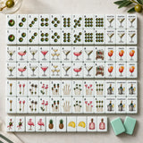 Rows of American mahjong tiles with illustrated artwork on a pale green background
