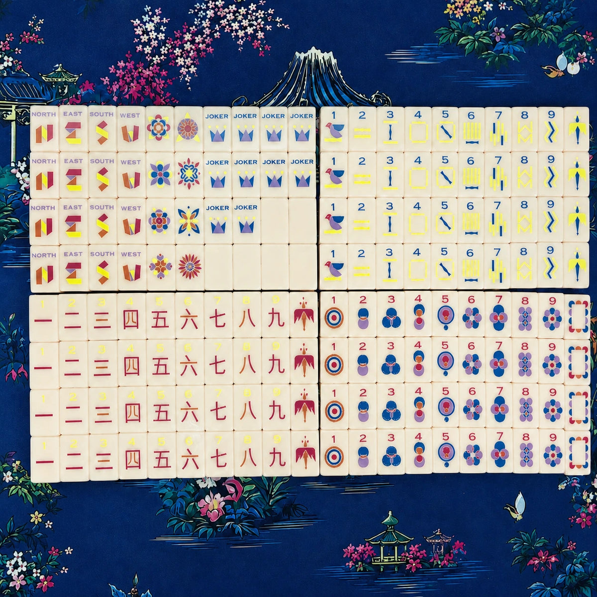 Full Mahjong tile set arranged in neat rows on a dark blue background