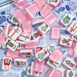 Colorful American Mahjong tiles with playful pink designs