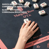 Hand playing Mahjong on Midnight Blossom Mahjong mat