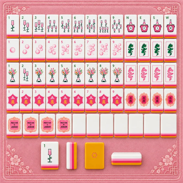 Rows of American mahjong tiles with red and pink artwork on a pink background
