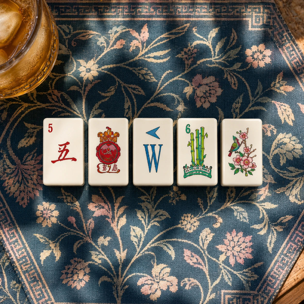 Mahjong tiles displayed in a decorative tabletop game setting