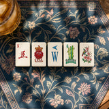 Mahjong tiles displayed in a decorative tabletop game setting