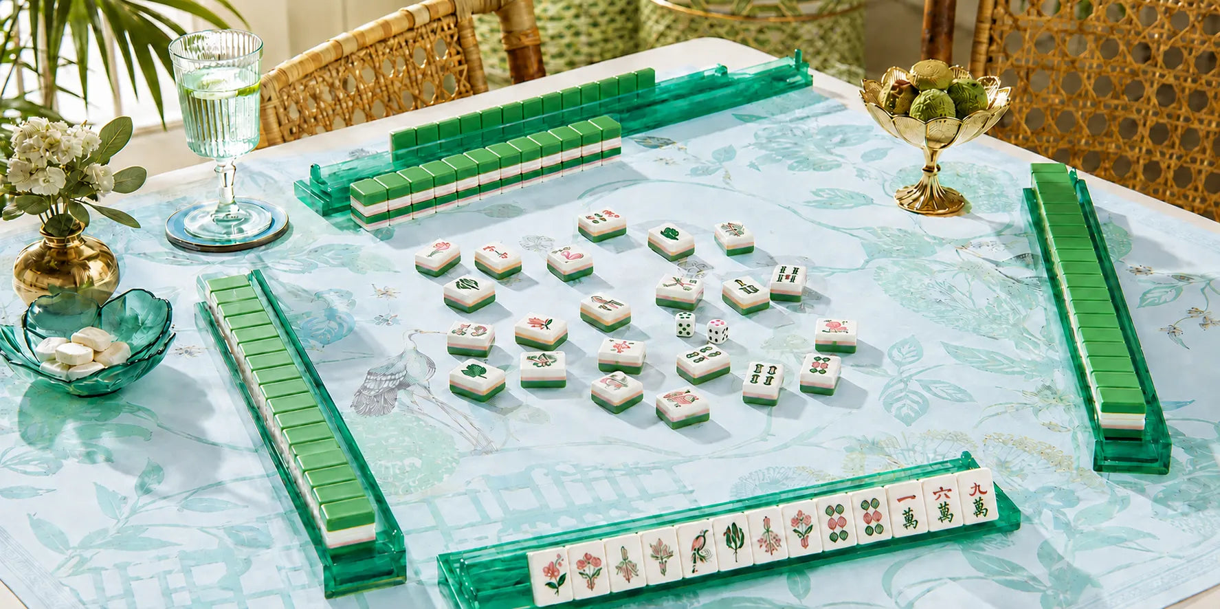 Green botanical mahjong table setup with floral tiles, clear racks and coordinated accessories