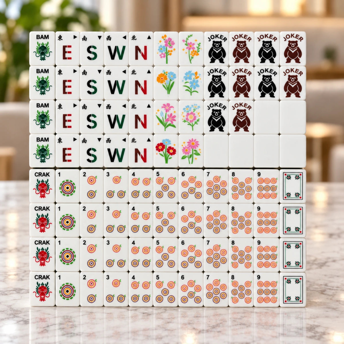 Neatly arranged American mahjong tiles with winds, flowers and jokers on a marble table