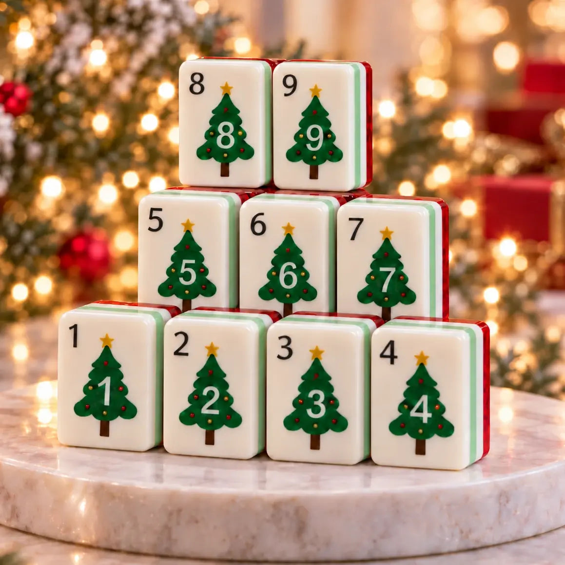 Rows of mahjong tiles with green Christmas tree designs and a gingerbread man tile on a festive table
