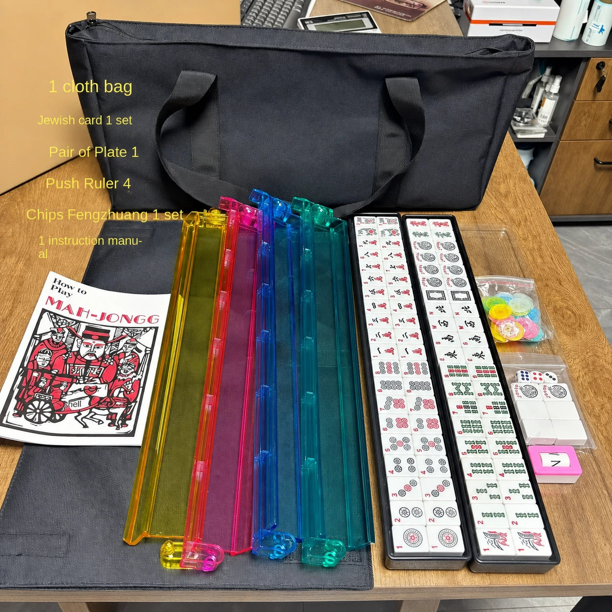 American Mahjong tile set with black carrying bag and rainbow tile pushers