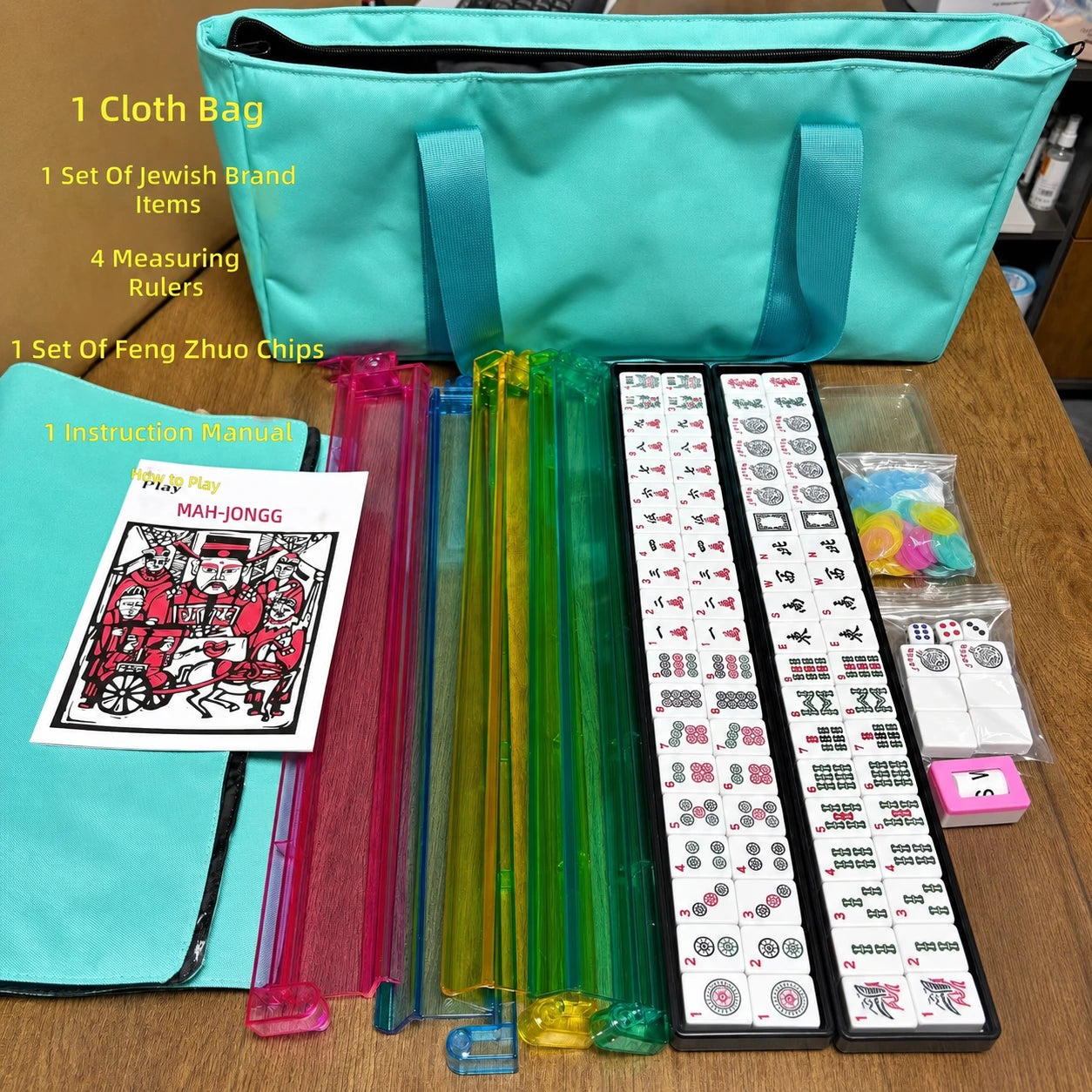 American Mahjong tile set with teal carrying bag and rainbow tile pushers