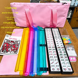 American Mahjong tile set with pink carrying bag and rainbow tile pushers