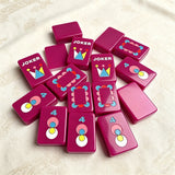 Neon purple single-layer mahjong tile set with colourful engraved designs displayed on a soft fabric surface