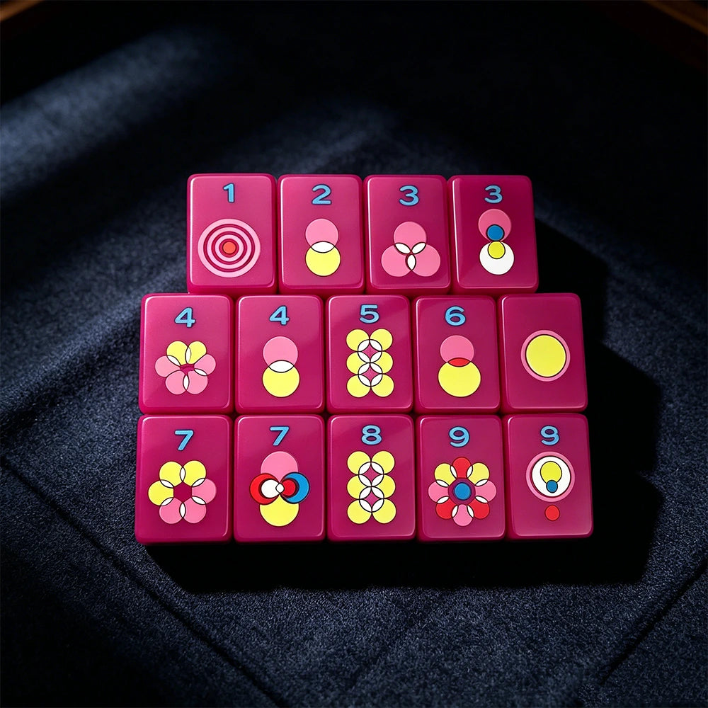 Single-layer neon purple mahjong tile set featuring colourful modern tile designs arranged on a dark surface