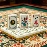 Turmeric yellow American mahjong tile set displayed on a floral game table with detailed engraved tile designs