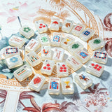 Blue and white mahjong tile collection in a premium display