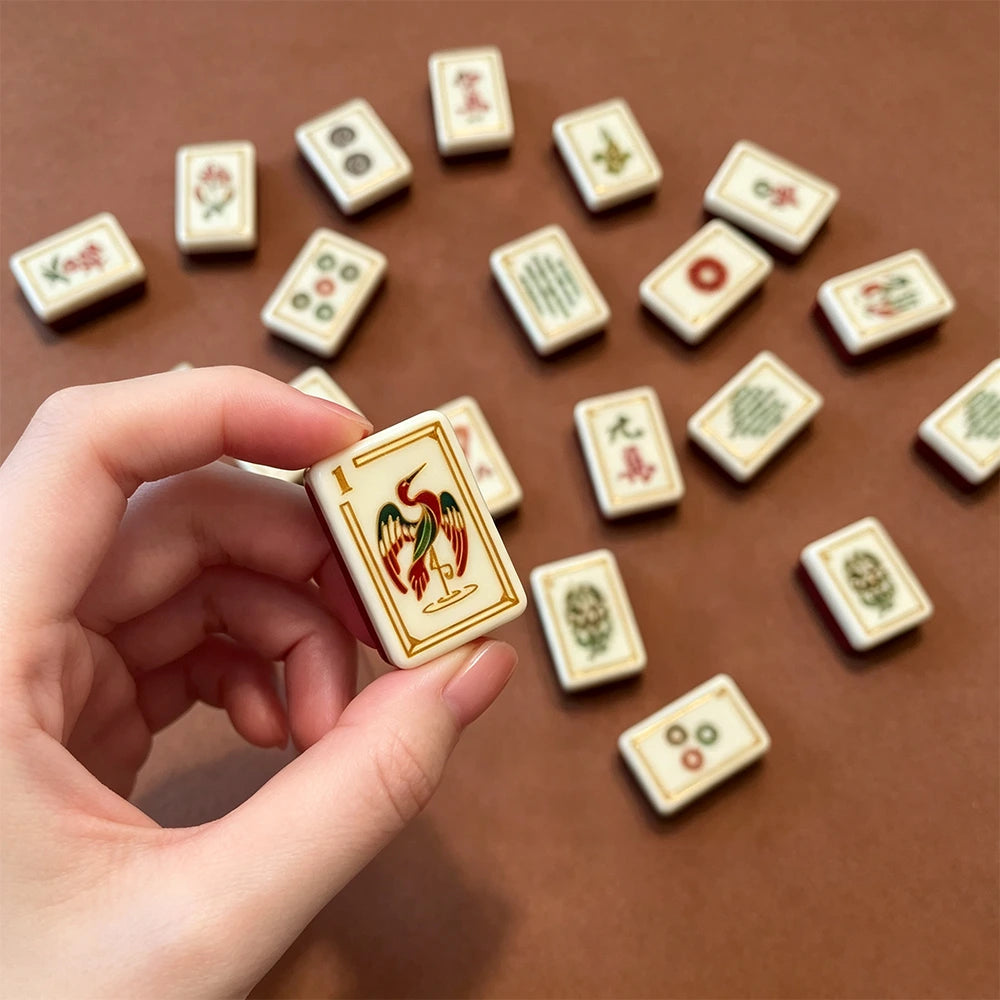 Brown mahjong tile set displayed with elegant accessories