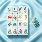 Light blue mahjong table set with elegant tile arrangement