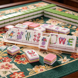 Luxury pink mahjong table display with elegant tile arrangement