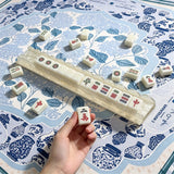 Mahjong pusher hand use detail showing practical tile pushing function