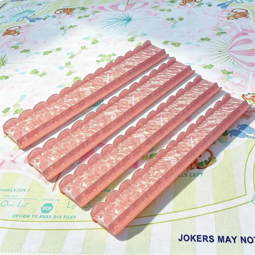Pink acrylic mahjong tile pusher set with pearl texture finish and elegant design
