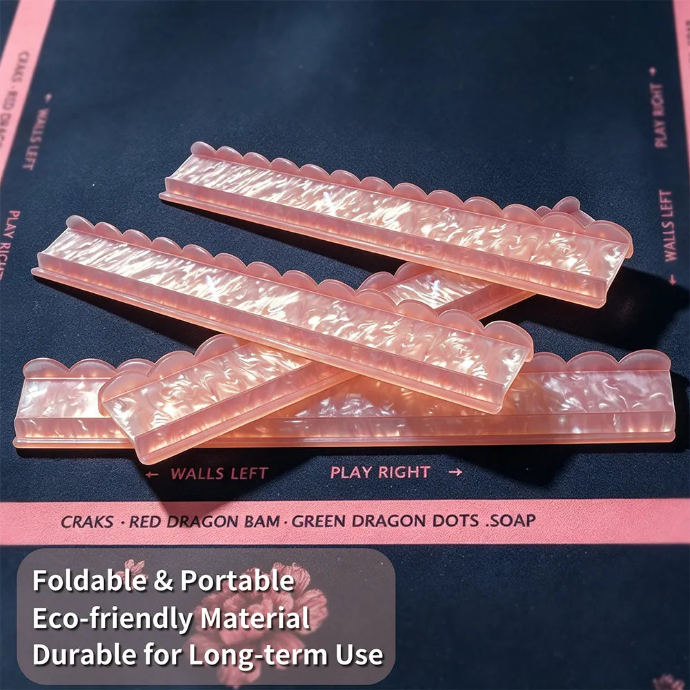 Pink acrylic mahjong tile pusher displayed with mahjong tiles on a decorative game table