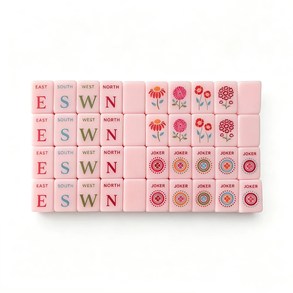 Top view of a pink mahjong tile set arrangement