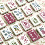 Pink patterned mahjong tiles displayed in a luxury arrangement