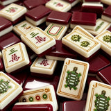 Premium mahjong tile set displayed with elegant accessories