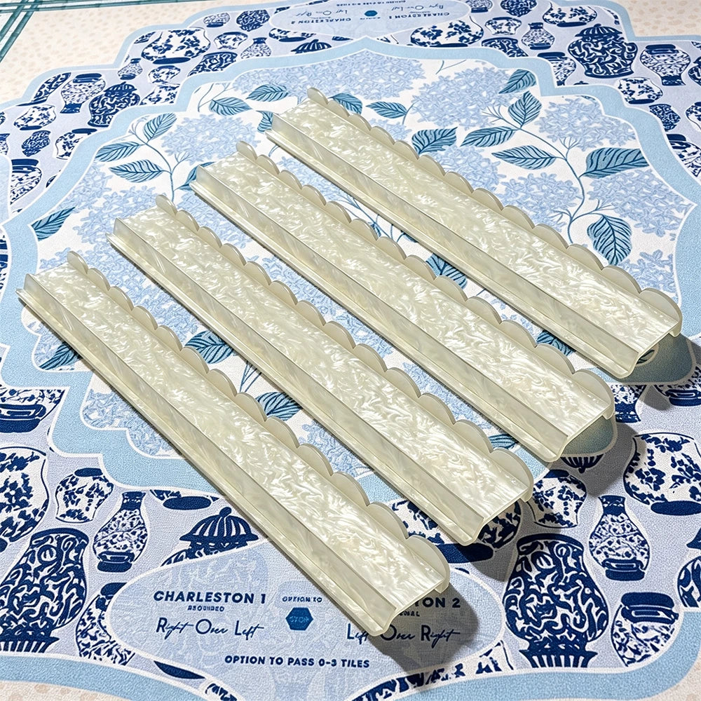 White mahjong push stick displayed with smooth acrylic surface and refined design