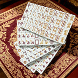 White mahjong tile set arranged in a premium display setting